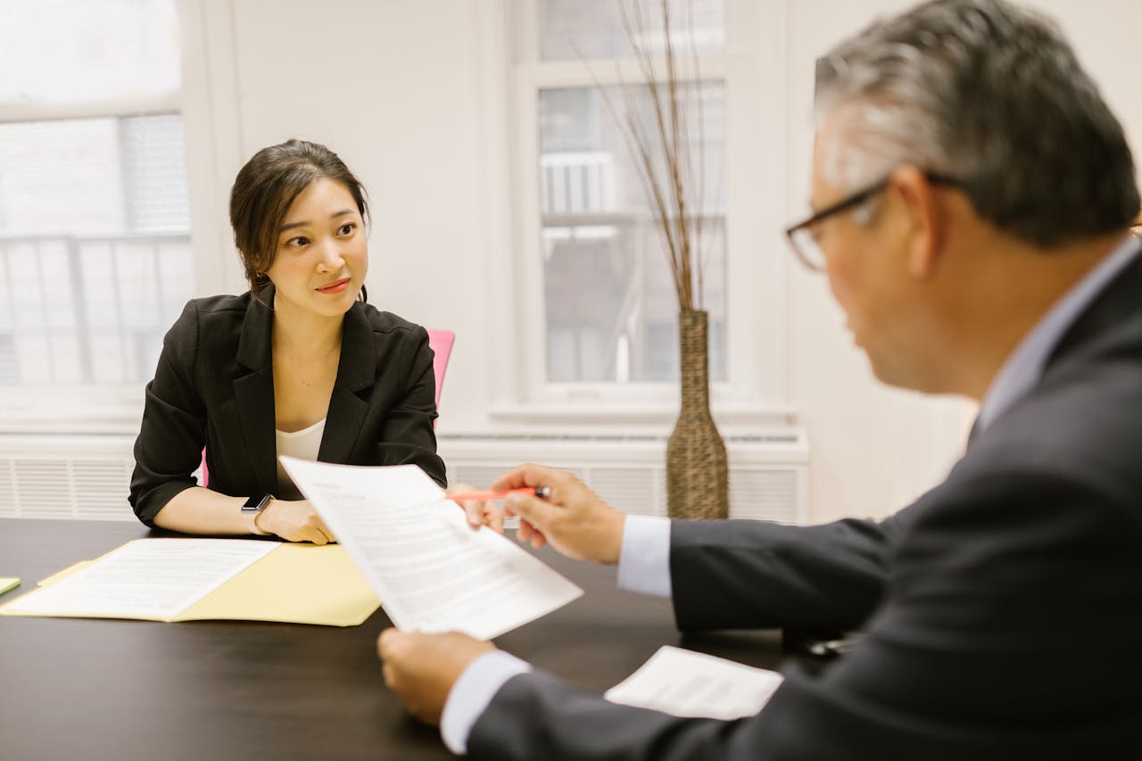 Two People Having a Meeting in the Office